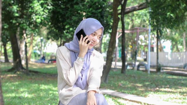 A girl taking a call on her mobile phone. 